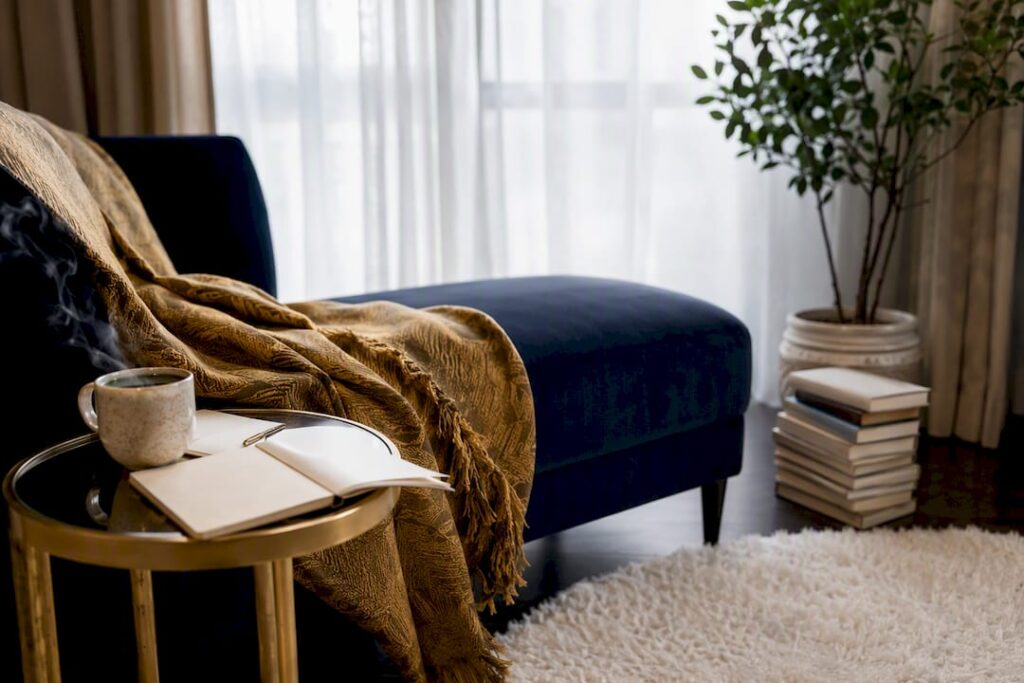 Cozy reading nook with tea and journal