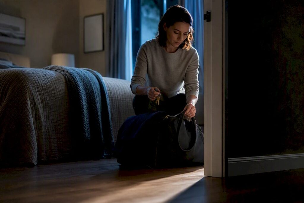 Woman preparing essentials for safe departure
