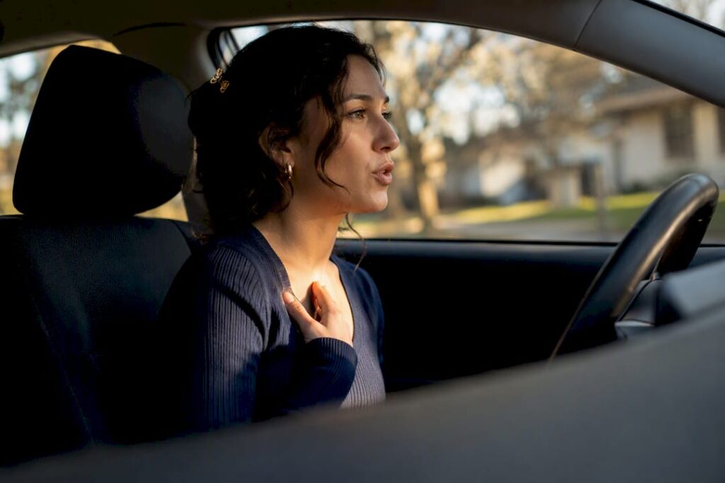 Woman rehearsing a boundary statement in car